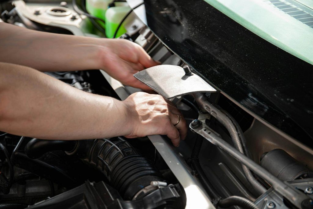 remaps coventry 10 hands repairing a car engine
